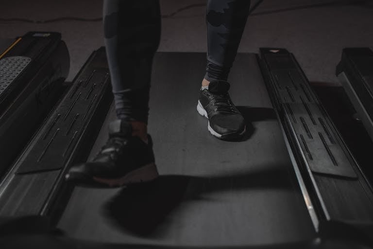 Person in Black Pants and Black Sneakers